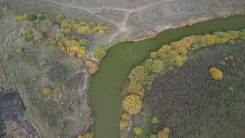 Drone flight along winding river with pronounced curve and contrasting banks 動画素材 334329821