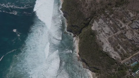 Drone flight and pan from bottom to top over the ocean coast with big waves. Stock-Footage 121851972