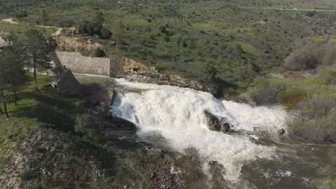 Drone flight approaching dam spillway waterfall Video stock 331720438