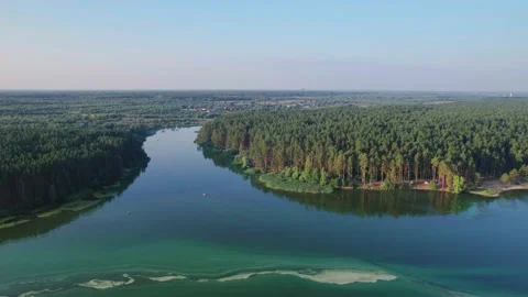 Drone flight around along lake and river bank with camping site Stock Footage 219567984