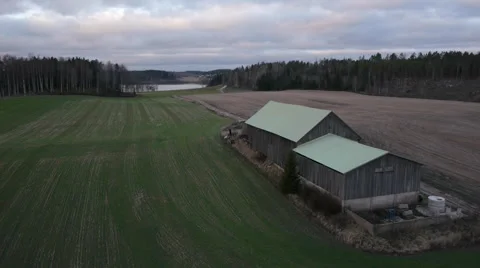 Drone flight around a barn in the field Stock Footage 44933090