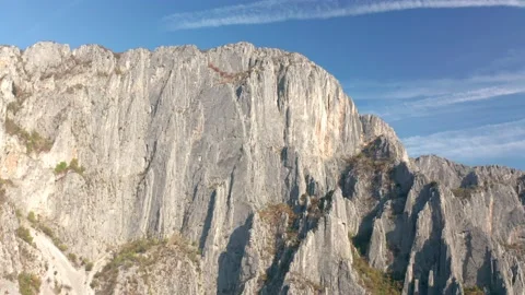 Drone flight around beautiful sheer cliffs Stock Footage 146167129