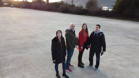 Drone flight around a group of friends Stock Footage 124385313