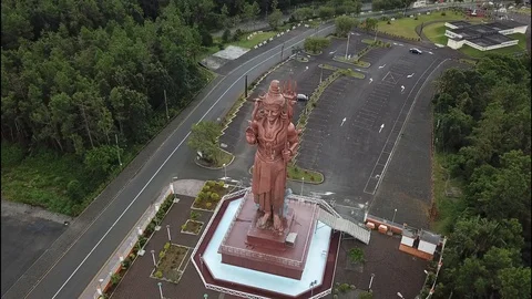 Drone flight around Hindu statue in Mauritius Stock Footage 113476532