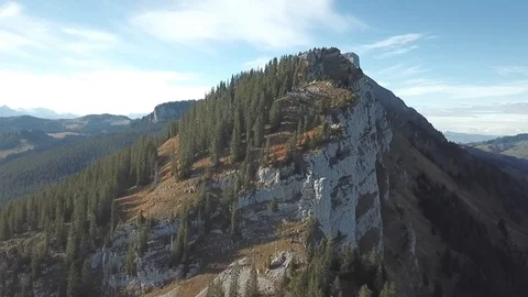 Drone flight around mountain with forest in Swiss alps. Stock Footage 107087251