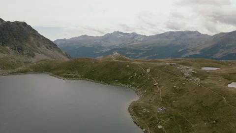 Drone flight around Rifugio Bertacchi at Emet Lake in Madesimo - Italian Alps Stock Footage 251989286