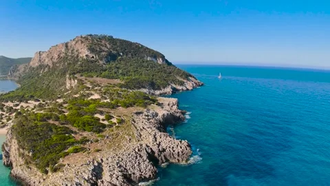 Drone flight around rocky peninsula at Voidokilia Beach Greece Stock Footage 335895276