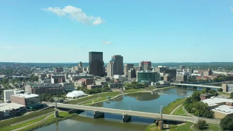 Drone flight backing over river revealing bridges and downtown Dayton Ohio s Stock Footage 149188674