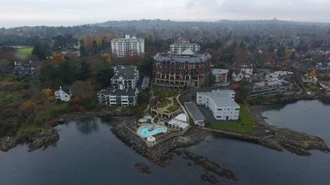 Drone flight backward of hotel and pool on shore Video stock 127003393