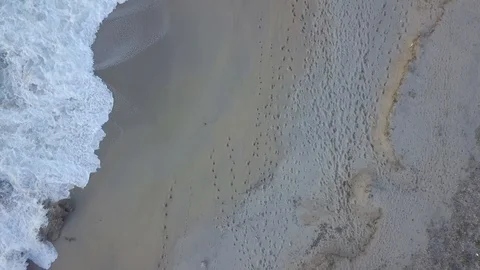 Drone flight of beach shoreline with waves Stock Footage 94508675