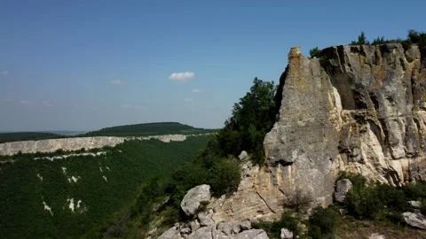 Drone flight from behind a rock Stock Footage 160855125