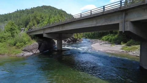 Drone Flight Beneath Reinforced Concrete Bridge Over Assemetquagan River Video stock 342859909