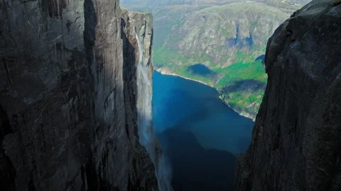 Drone flight between massive cliffs at Kjerag with Lysefjord in Norway. Stock Footage 328129650