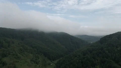 Drone flight between mountains and fog Stock Footage 137943963