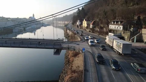 Drone Flight Close to Schanzl Bridge Over Traffic with Ships on Danube in Winter Stock Footage 327486146