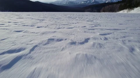 Drone flight close to the snow to sunset Stock Footage 224329646