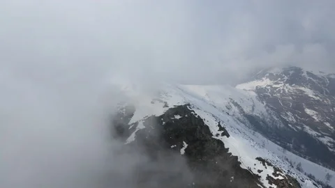 Drone flight into the clouds in natural mountains environment. alps 4k Stock Footage 150871799