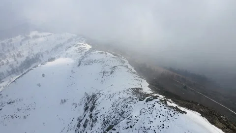 Drone flight into the clouds over the ridge of the mountain with trekking people Stock Footage 150871511