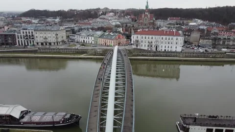 Drone flight in cloudy weather over the footbridge over the Vistula Stock Footage 221578055