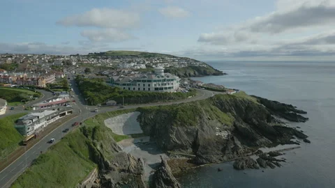 Drone flight of coastal cliffs with railway - Isle of Mann Stock Footage 235357767