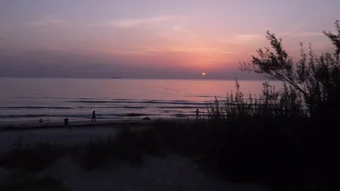 Drone Flight from Dark Sand Dune to Baltic Sea Sunset Stock Footage 326295874