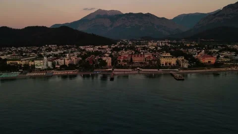 Drone flight at dawn over the city by the sea, Turkey 4k Video stock 214827296