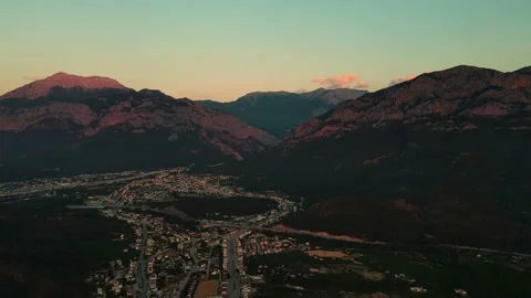 Drone flight at dawn over a small town between mountains, Turkey, kemer, 4k Stock Footage 217740207