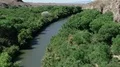 drone flight down stream on the Gila River with cliff side part A HD Footage
