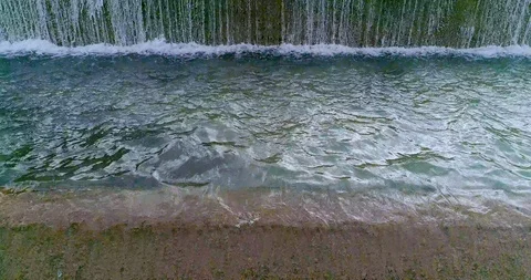 Drone flight down the turquoise river channel waterfalls Stock Footage 124378273