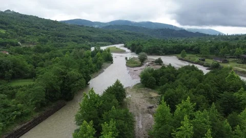 Drone flight downstream, over mountains river Tekhuri valley, Martvili Stock Footage 343672380