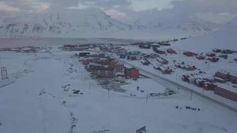 Drone flight forward. Aerial view of Longyearbyen city, Svalbard in winter. Stock Footage 317934756