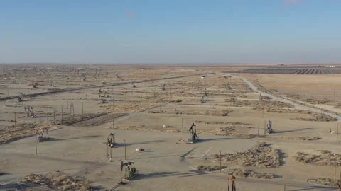 Drone flight forward over oil pumps in Central California, USA. Video stock 265166554
