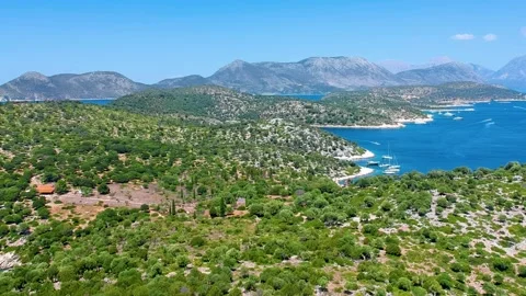 Drone flight high above beautiful tropical islands, mountains, and trees Stock Footage 234401021