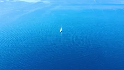 Drone flight high above sailing boat and stunning blue tropical waters Stock Footage 234398216