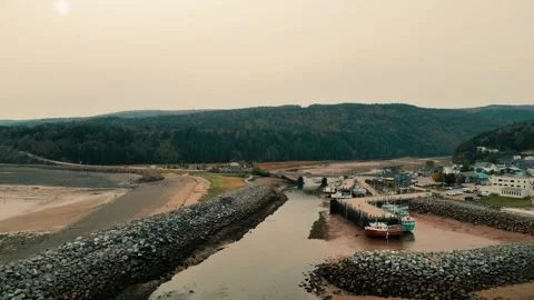 Drone Flight High Over Harbour During Low Tide With Boats On The Ocean Floor Stock Footage 254998309