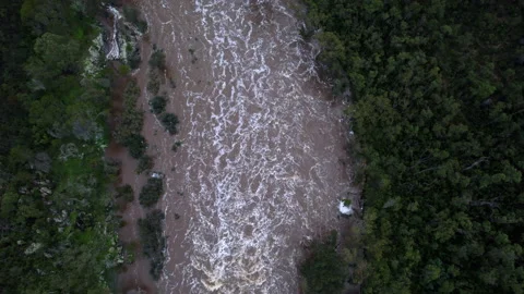 Drone flight hovering above flooded river Stock Footage