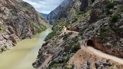 Drone flight inside the deep rocky gorge of Karanlik Canyon revealing the Video stock 336408625