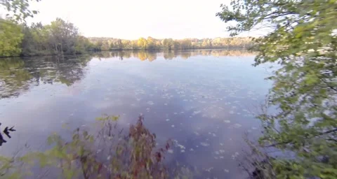 Drone flight off land over river Stock-Footage 55305084