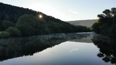 Drone flight low over river at sunrise with the fog. Videos 4K. Stock Footage 197020895