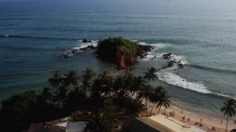 Drone flight from Mirissa beach towards Parrot Rock island Stockbeeldmateriaal 316752801