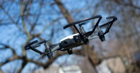 A drone in flight monitors a protected area. The most effective security syst Stock Photos
