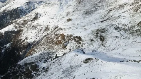 Drone flight in mountain landscape with snow. Alps, Italy. Aerial video footage. Stock Footage 148031183