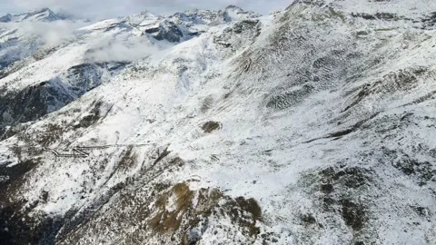 Drone flight in mountain landscape with snow. Aerial video footage. Alps 4K Stock Footage 148031188