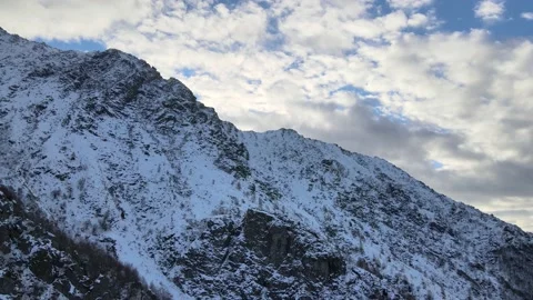 Drone flight in mountain landscape with snow. Aerial video footage. 4K Stock Footage 148031437