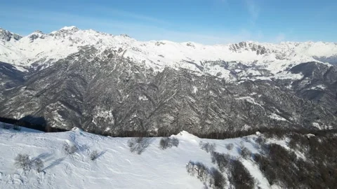 Drone flight in mountains landscape with snow. Alps 4K. View from peak to valley Stock Footage 147858770