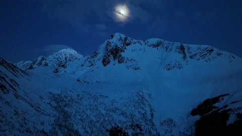 Drone flight in the mountains to the moon in winter in 4k Stock Footage 224019112