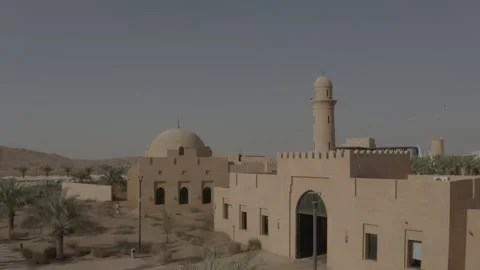 Drone flight over abandoned arabic town with mosque in the desert Stock Footage 205552754