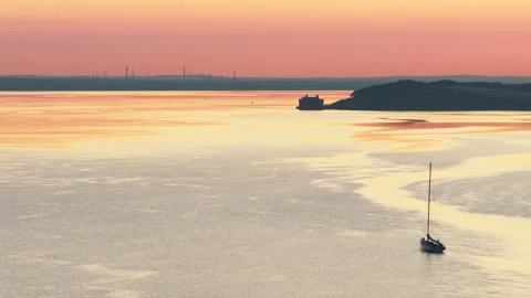 Drone Flight Over Alum Bay with Yacht and Fawley Refinery in Distance Stock Footage 338054873