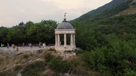 A drone flight over an ancient building at sunset in Pyatigorsk. The mountains Stock Footage 158817233