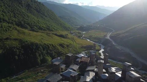 Drone Flight Over Ancient Ushguli Rooftops and Mountain Road  4K 스톡 동영상 312339887